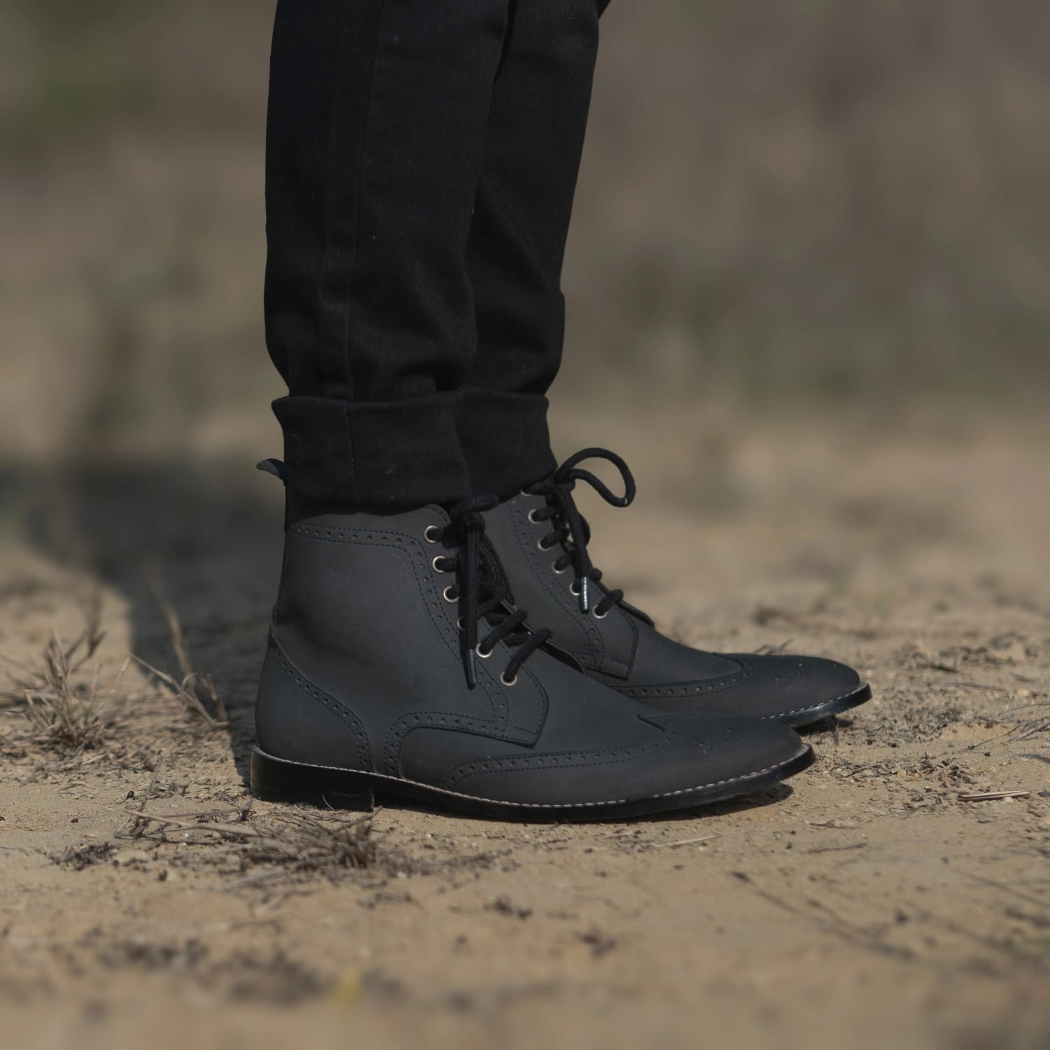 Black leather wingtip boots outlet
